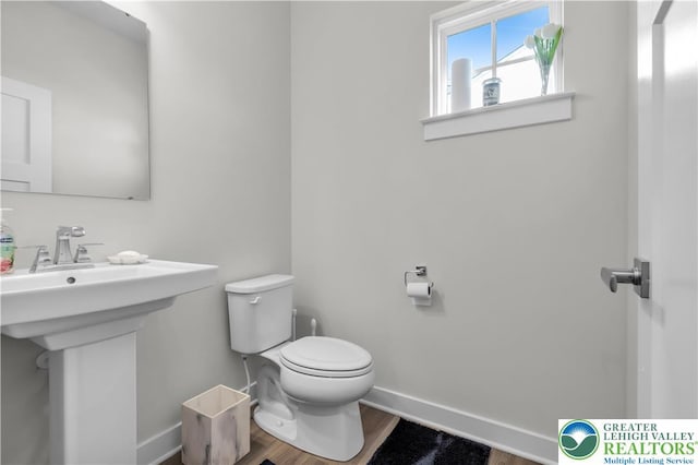 8202 Young Blvd, Upper Macungie Twp, PA 18051 - half bath featuring toilet, wood finished floors, and baseboards