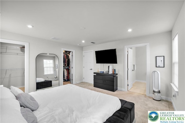 8202 Young Blvd, Upper Macungie Twp, PA 18051 - bedroom with multiple closets, light colored carpet, recessed lighting, baseboards, and ensuite bathroom