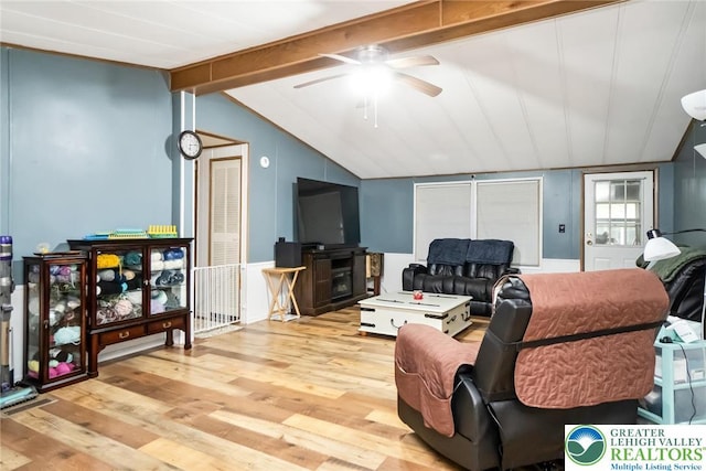 living area featuring wood finished floors and ceiling fan