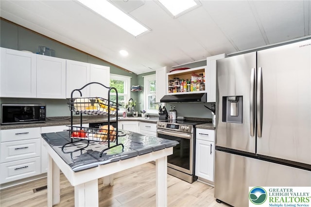 kitchen featuring appliances with stainless steel finishes, lofted ceiling, white cabinets, open shelves, and under cabinet range hood