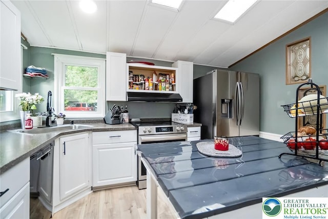kitchen featuring appliances with stainless steel finishes, a sink, white cabinets, under cabinet range hood, and open shelves