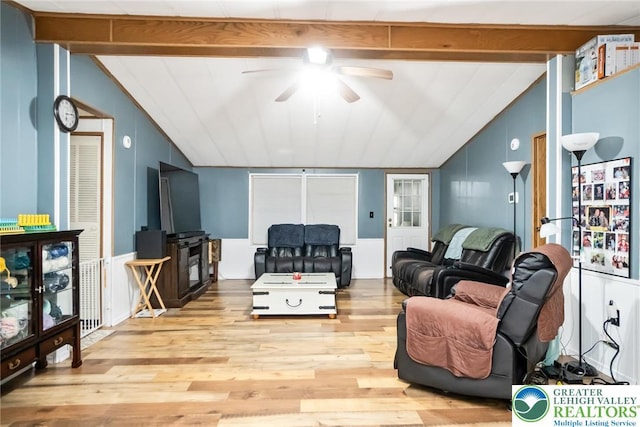 living room with ceiling fan and wood finished floors