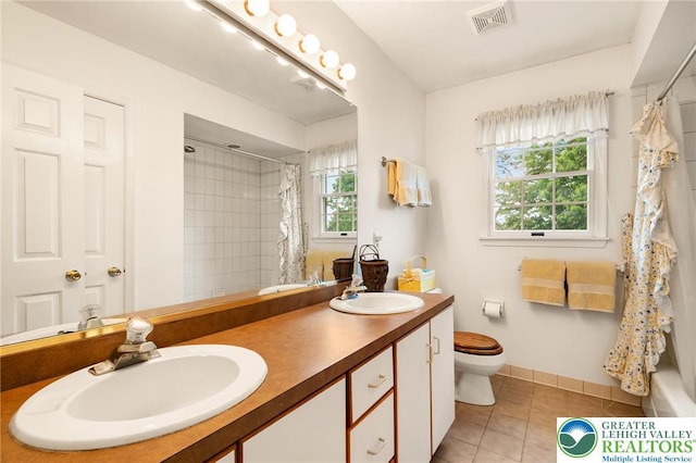 bathroom featuring tile patterned floors, toilet, curtained shower, double vanity, and baseboards