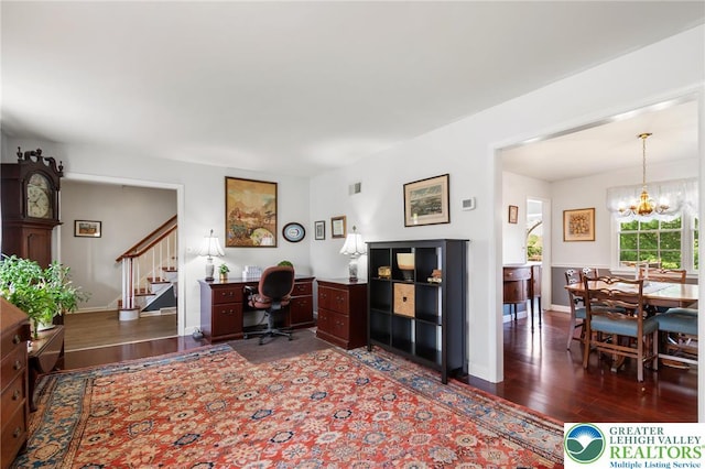 office area featuring wood finished floors, a chandelier, and baseboards