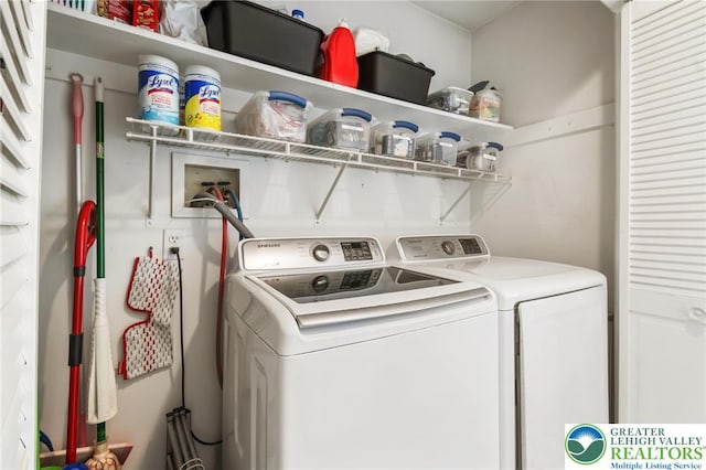 clothes washing area featuring separate washer and dryer
