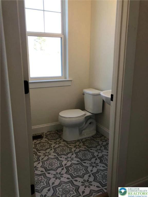 65 Island Ct, Williams Twp, PA 18042 - bathroom featuring toilet and baseboards