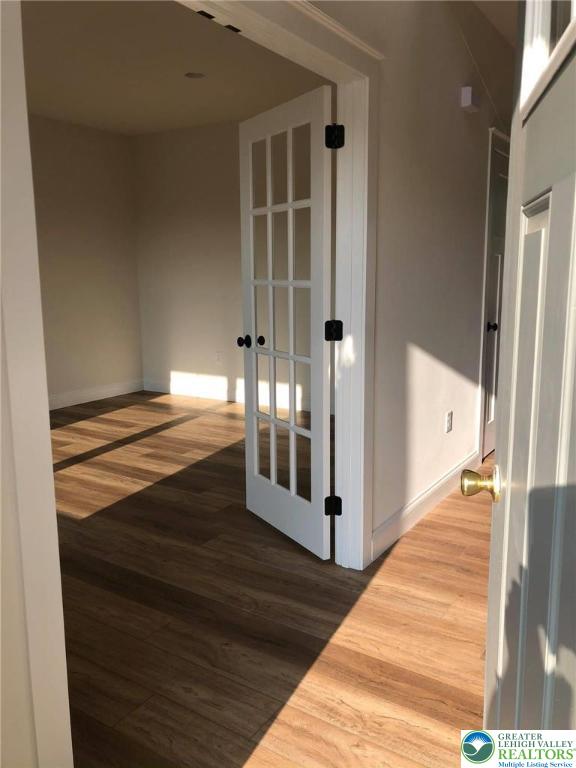 65 Island Ct, Williams Twp, PA 18042 - hallway featuring wood finished floors and baseboards