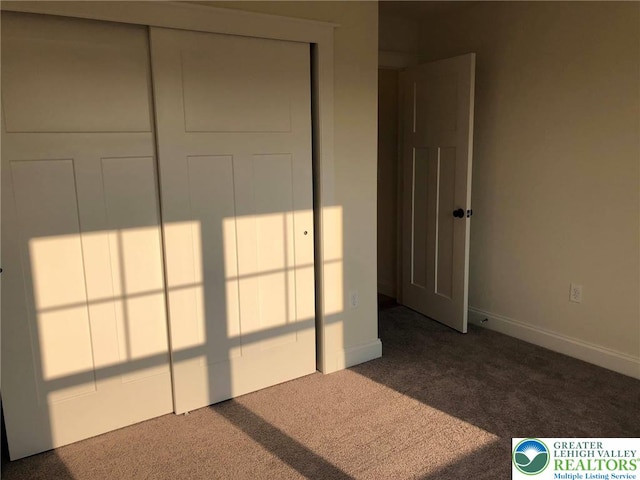 65 Island Ct, Williams Twp, PA 18042 - unfurnished bedroom featuring dark colored carpet and baseboards
