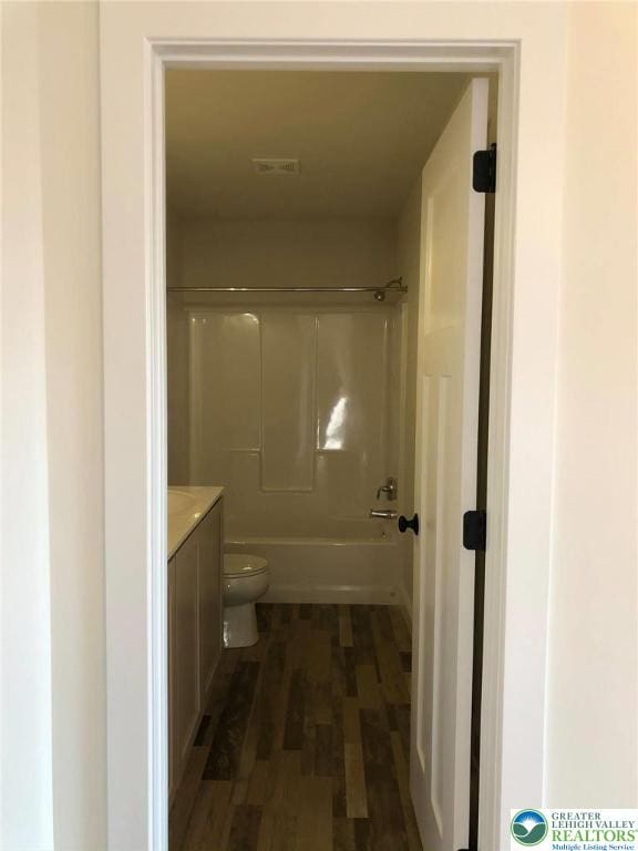 65 Island Ct, Williams Twp, PA 18042 - full bath with vanity, wood finished floors, toilet, and  shower combination