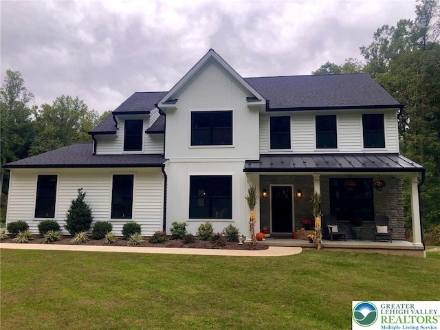 65 Island Ct, Williams Twp, PA 18042 - modern farmhouse featuring covered porch, a standing seam roof, a front lawn, metal roof, and roof with shingles