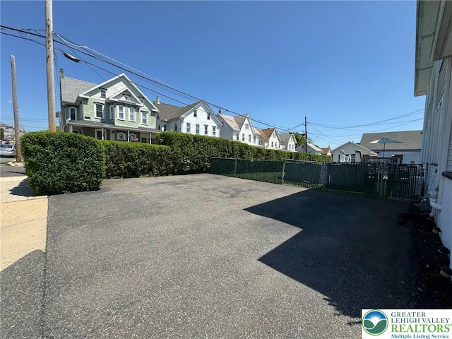 view of yard featuring a residential view and fence
