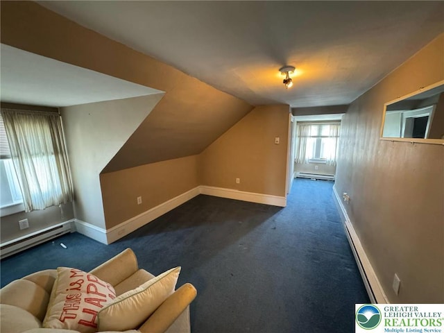 additional living space with baseboard heating, baseboards, vaulted ceiling, and carpet floors