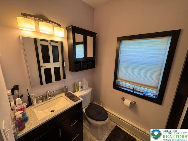 bathroom featuring baseboard heating, toilet, and vanity