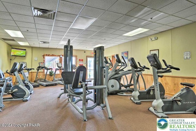 2171 Lancaster Dr, Lehman Twp, PA 18324 - exercise room with a paneled ceiling and wainscoting