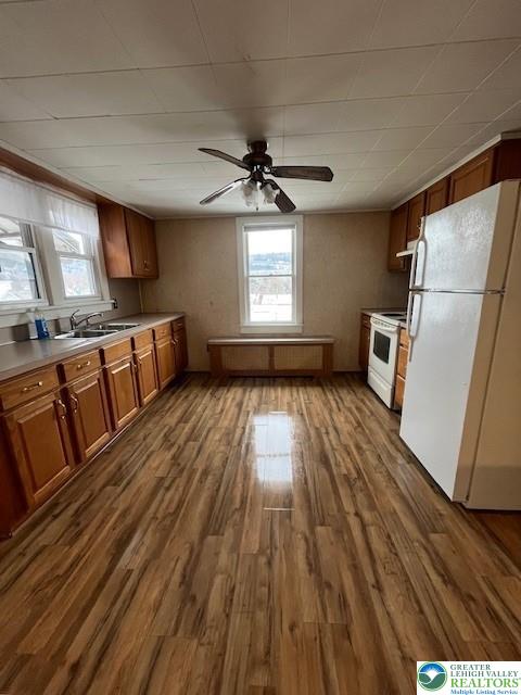 416 E Union St Unit 1 & 2, Tamaqua Borough, PA 18252 - kitchen featuring white appliances, a sink, plenty of natural light, and brown cabinetry