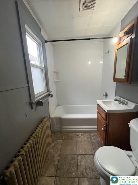 416 E Union St Unit 1 & 2, Tamaqua Borough, PA 18252 - full bath with radiator heating unit, toilet, vanity, and shower / bathtub combination