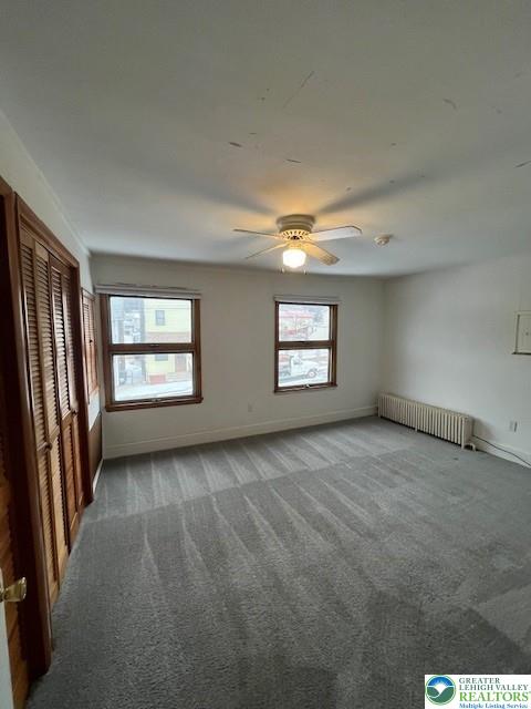 416 E Union St Unit 1 & 2, Tamaqua Borough, PA 18252 - carpeted spare room featuring radiator heating unit, baseboards, and a ceiling fan