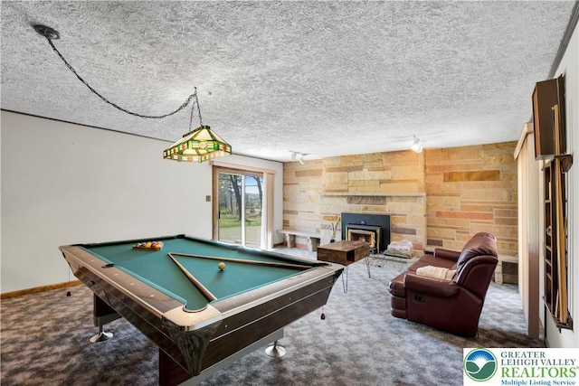 recreation room with carpet flooring, pool table, a textured ceiling, baseboards, and a fireplace