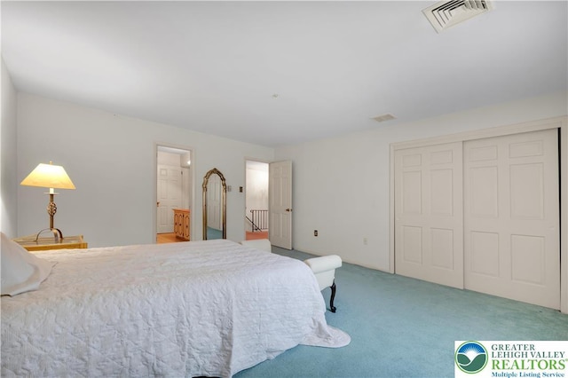 carpeted bedroom featuring a closet