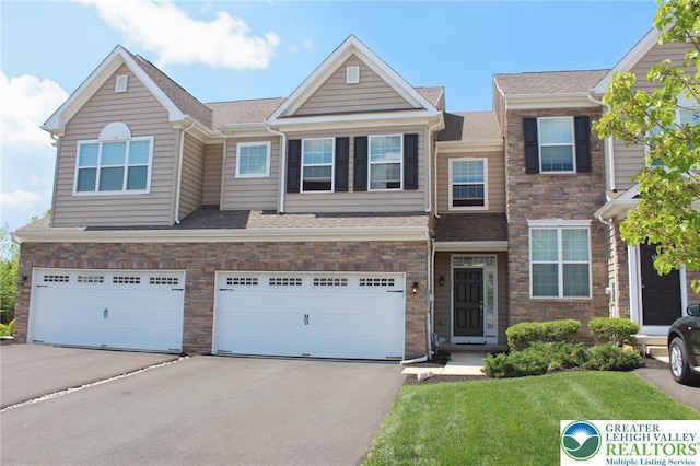 306 Redclover Ln, Upper Macungie Twp, PA 18104 - view of property with driveway, an attached garage, a front yard, and roof with shingles