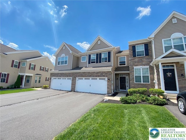 306 Redclover Ln, Upper Macungie Twp, PA 18104 - view of property featuring an attached garage, driveway, stone siding, and a front yard