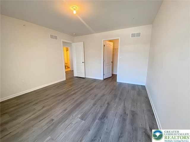 306 Redclover Ln, Upper Macungie Twp, PA 18104 - unfurnished bedroom featuring dark wood-style floors and baseboards