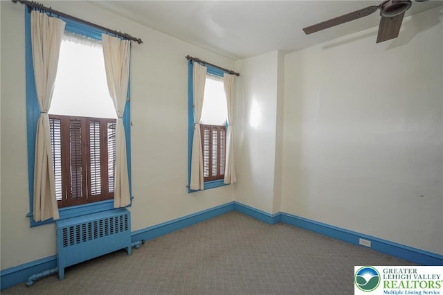 415 Hazle St, Tamaqua Borough, PA 18252 - spare room with radiator heating unit, carpet flooring, baseboards, and a ceiling fan