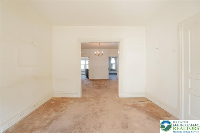 415 Hazle St, Tamaqua Borough, PA 18252 - unfurnished room featuring a chandelier, carpet floors, and baseboards