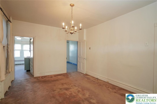 415 Hazle St, Tamaqua Borough, PA 18252 - unfurnished dining area featuring radiator heating unit, a chandelier, carpet flooring, and baseboards