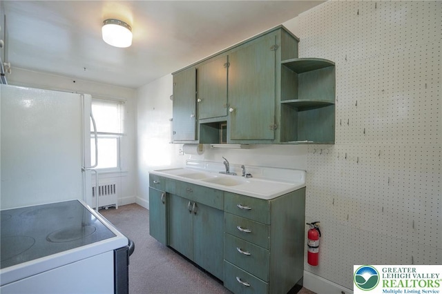415 Hazle St, Tamaqua Borough, PA 18252 - kitchen with white appliances, open shelves, radiator heating unit, baseboards, and a sink