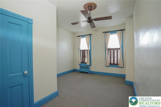 415 Hazle St, Tamaqua Borough, PA 18252 - carpeted empty room with radiator, baseboards, and a ceiling fan