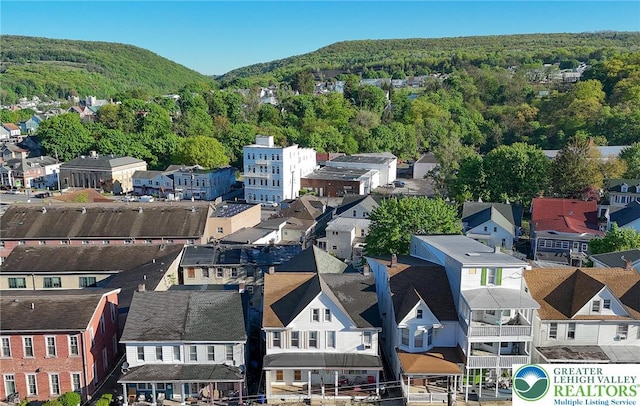 415 Hazle St, Tamaqua Borough, PA 18252 - aerial perspective of suburban area featuring a forest and a mountainous background