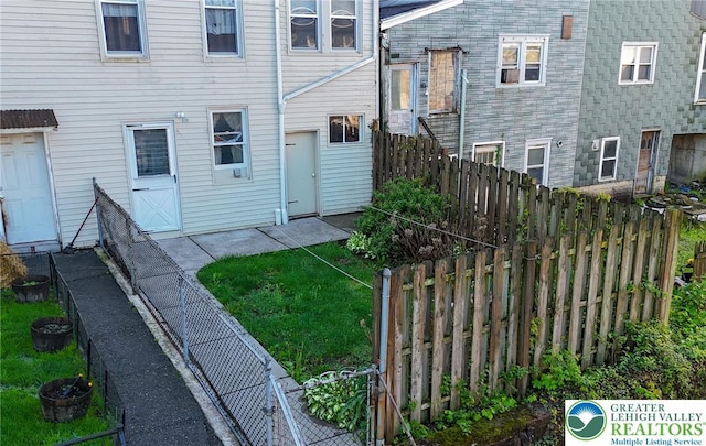 415 Hazle St, Tamaqua Borough, PA 18252 - rear view of house with a fenced backyard