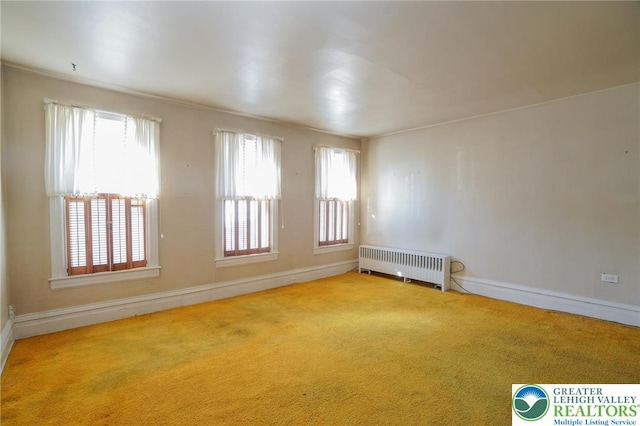 415 Hazle St, Tamaqua Borough, PA 18252 - carpeted empty room with radiator heating unit, plenty of natural light, and baseboards
