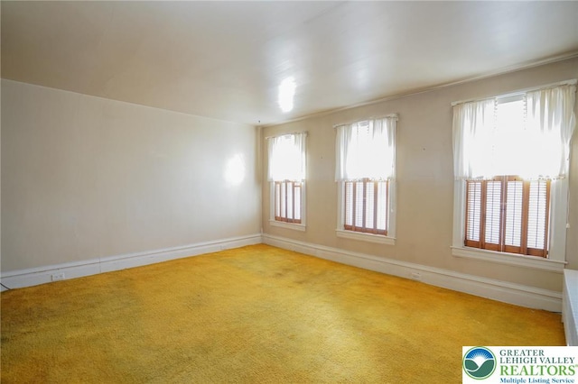 415 Hazle St, Tamaqua Borough, PA 18252 - empty room featuring carpet flooring, healthy amount of natural light, and baseboards