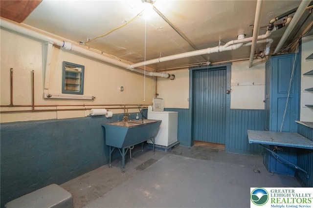 415 Hazle St, Tamaqua Borough, PA 18252 - below grade area with washer / clothes dryer, a wainscoted wall, and a sink