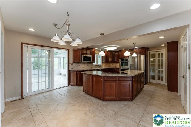 kitchen featuring stainless steel appliances, recessed lighting, healthy amount of natural light, light stone counters, and backsplash