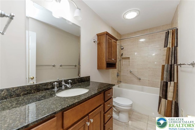 bathroom featuring tile patterned flooring, toilet, shower / bath combo with shower curtain, and vanity