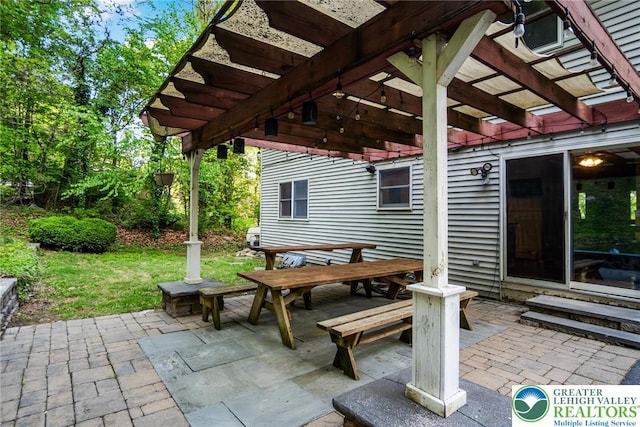 view of patio with a pergola and outdoor dining area