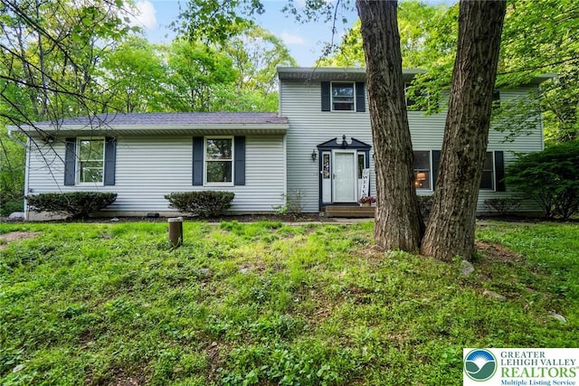 view of front of home with a front lawn