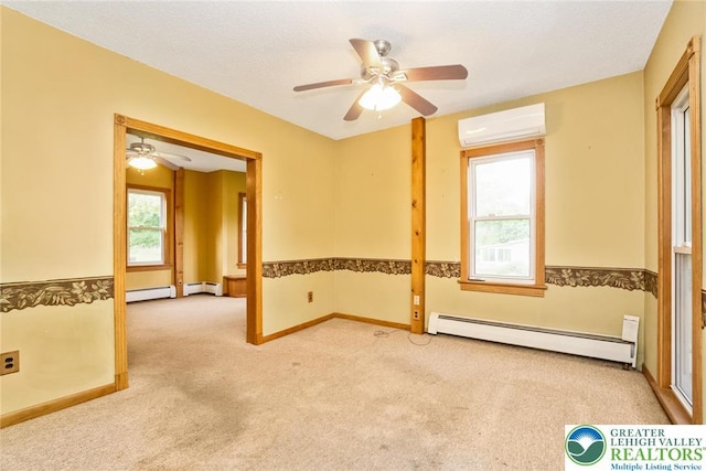 empty room featuring a baseboard radiator, carpet, an AC wall unit, and a ceiling fan