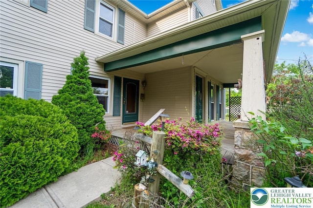 doorway to property with a porch