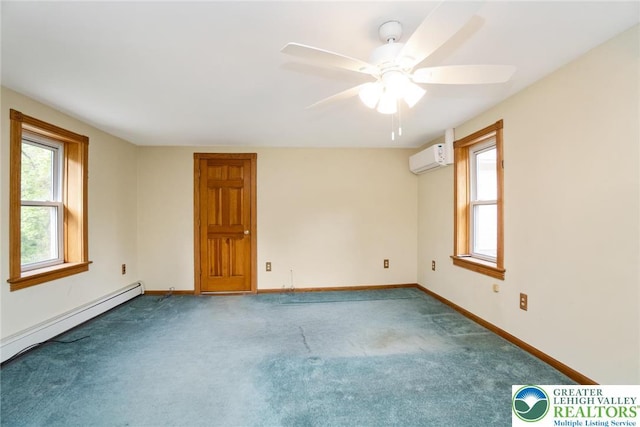 carpeted spare room with a wall unit AC, plenty of natural light, baseboard heating, and baseboards