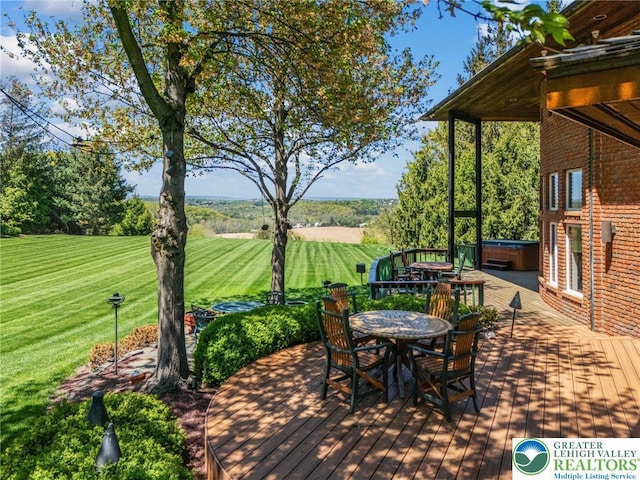 2342 Bobby Ct, South Whitehall Twp, PA 18069 - wooden terrace featuring a hot tub, a lawn, outdoor dining space, and a view of countryside
