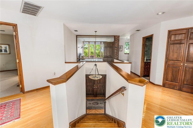 2342 Bobby Ct, South Whitehall Twp, PA 18069 - stairs featuring wood finished floors, baseboards, and recessed lighting
