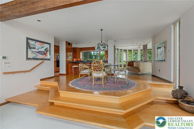 2342 Bobby Ct, South Whitehall Twp, PA 18069 - dining area with baseboards, light wood-style floors, and a chandelier