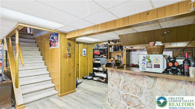 4168 Orefield Rd, South Whitehall Twp, PA 18104 - finished below grade area with wood finished floors, stairway, wooden walls, and a paneled ceiling
