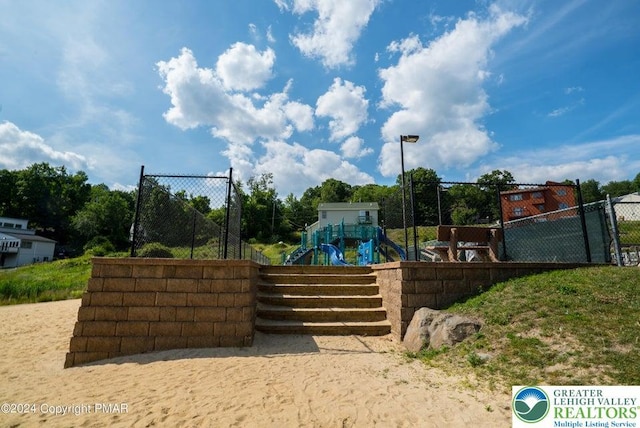 view of community featuring fence