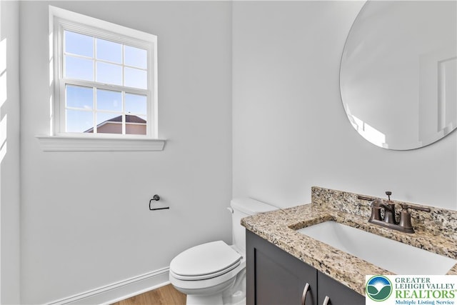 4779 Farrcroft Dr Unit 90, Forks Twp, PA 18040 - half bath featuring vanity, toilet, baseboards, and wood finished floors