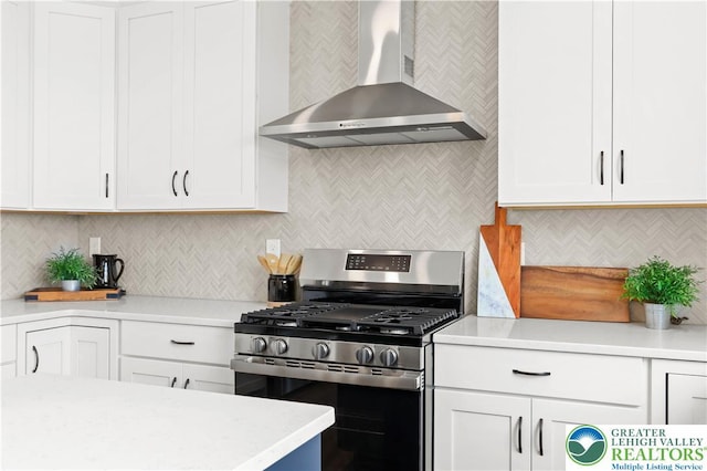4779 Farrcroft Dr Unit 90, Forks Twp, PA 18040 - kitchen featuring gas range, wall chimney exhaust hood, light countertops, and backsplash